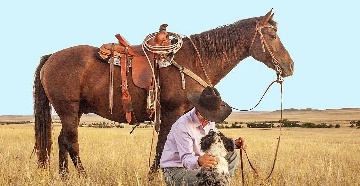 Cowboy, dog, and his horse with their cowboy gifts
