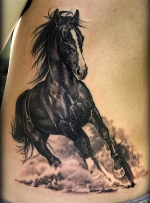 Running black horse tattoo on a woman's stomach