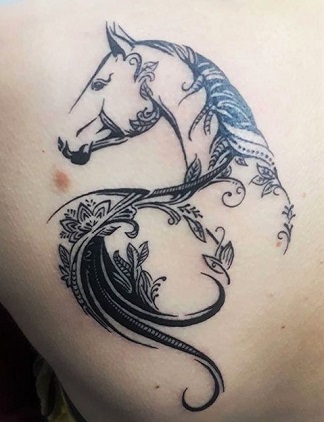 Black horse and tree branch with leaves horse tattoo