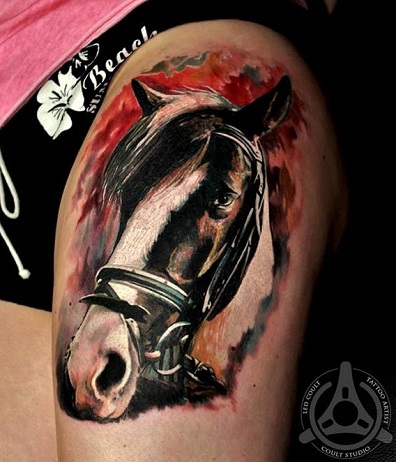 gypsy vanner horse head tattoo design on a womans leg upper thigh