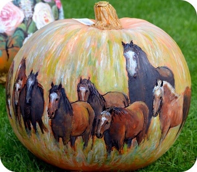 Herd of horses painted on a pumpkin