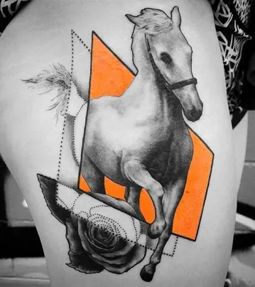 Unique horse tattoo black and orange on a womans thigh