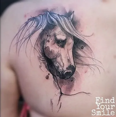 Beautiful horse head back tattoo