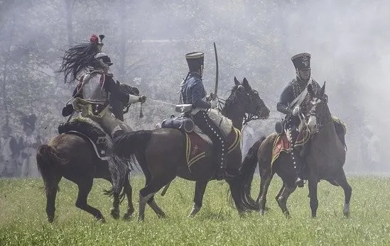 Horses being ridden into a battle being used for war