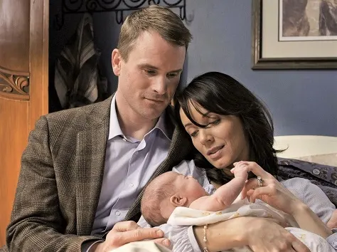 Peter Morris and Lou Fleming with their baby on Heartland