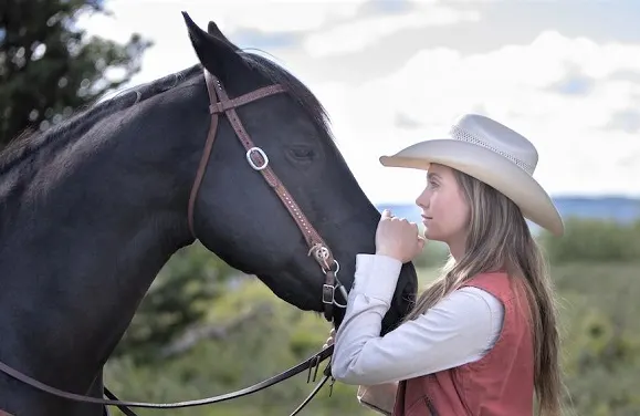 Amber Marshall stroking Spartan's forehead