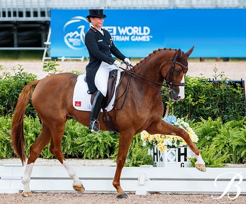 Isabell Werth riding a horse in a dressage test