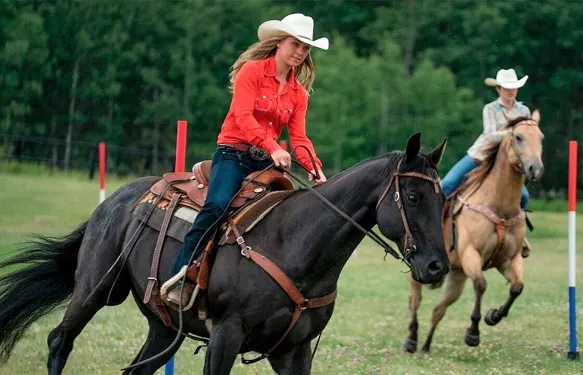 Amber Marshall riding Spartan on Heartland