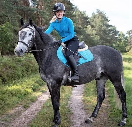 Esme Higgs riding her horse Joey