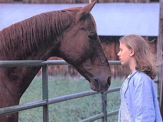 Scarlett Johansson and a horse in The Horse Whisperer