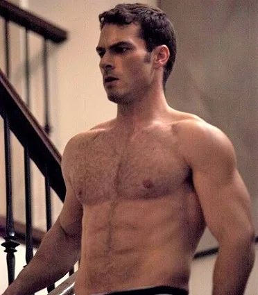 Actor Shawn Roberts with his top off showing his muscles