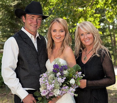 Amber Marshall wedding photo with her husband and mum