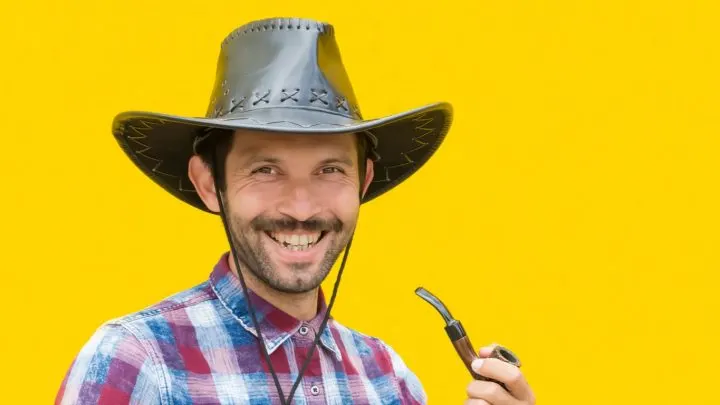 Cowboy laughing at the best cowboy jokes