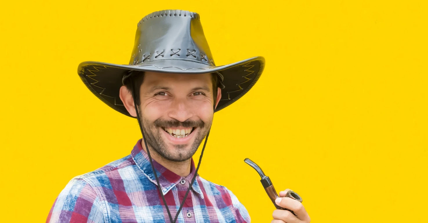 Cowboy laughing at the best cowboy jokes