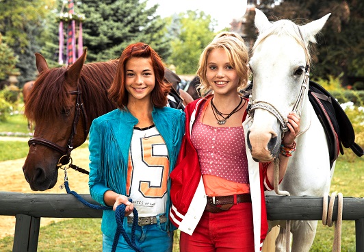 Bibi & Tina movie holding two horses