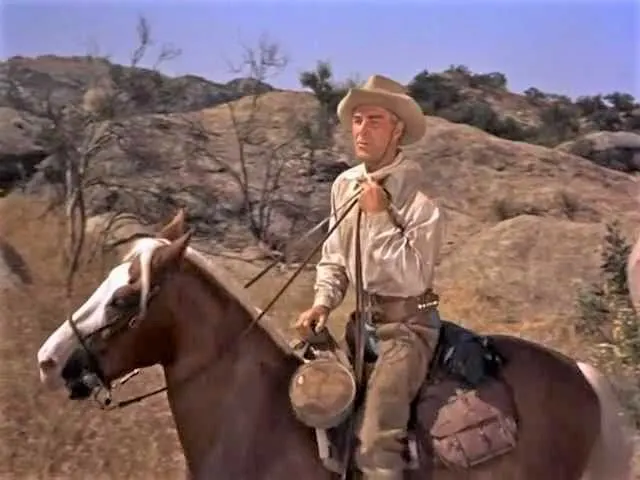 Randolph Scott riding his movie horse Stardust