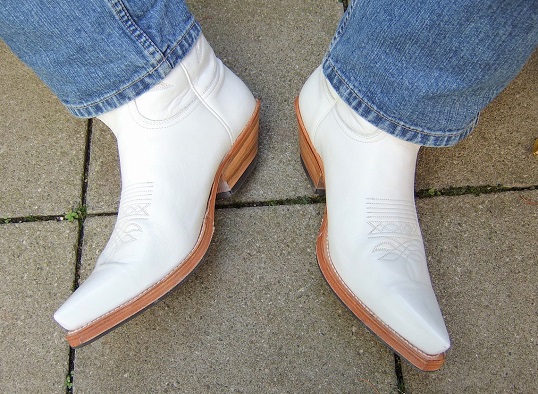 Stylish white pair of mens cowboy boots