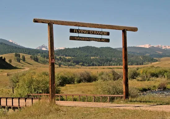 Flying D Ranch sign before a bridge entering the ranch
