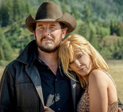 Beth Dutton and Rip Wheeler hugging on the Yellowstone show