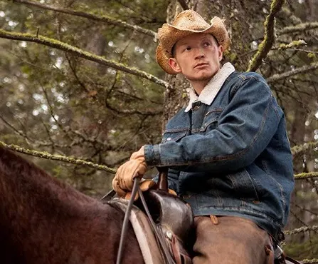 Jimmy riding a horse in the Yellowstone TV show