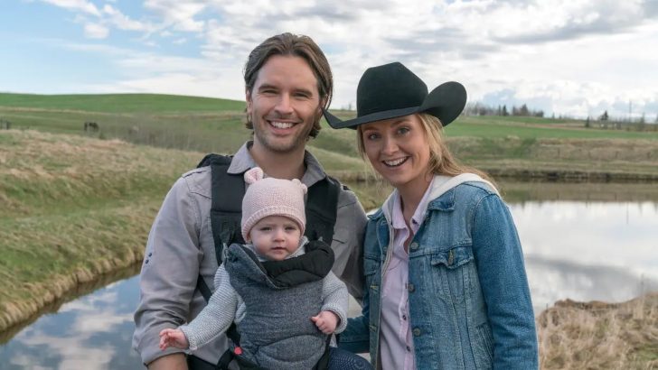 Ty Borden and Amy Fleming smiling with Ty holding their baby Lyndy