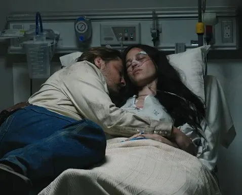 Kayce Dutton hugging Monica Dutton on a hospital bed after Monica is in a car crash and loses her unborn baby