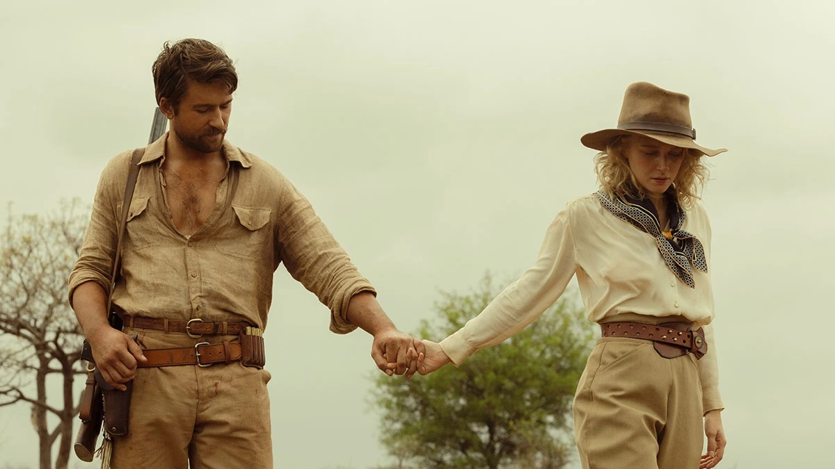 Spencer Dutton and Alexandra holding hands in Africa wilderness in the 1923 drama series