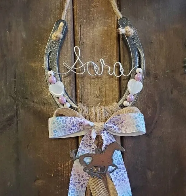 Personalized Rustic Hanging Horseshoe decor, featuring light purple beading, Tibetan-style silver accents, and a colorful cheetah ribbon