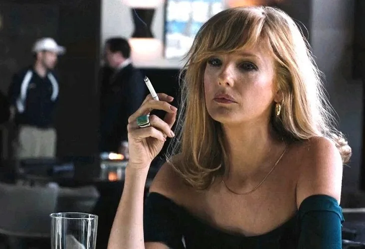 Beth Dutton at a bar smoking and drinking the Yellowstone TV series