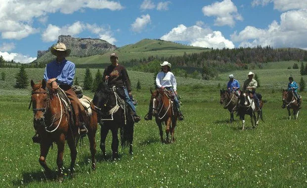 Guests out on a horse trail ride at Lazy L&B Ranch