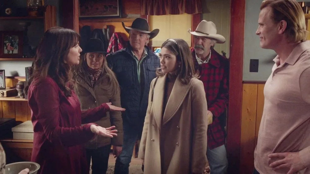 The main Heartland characters all together and talking in the Fleming home in Heartland season 16