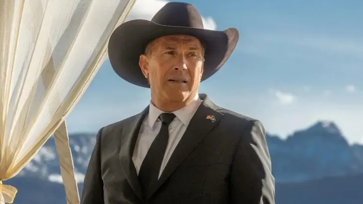 Kevin Costner dressed in a suit and cowboy hat in Yellowstone