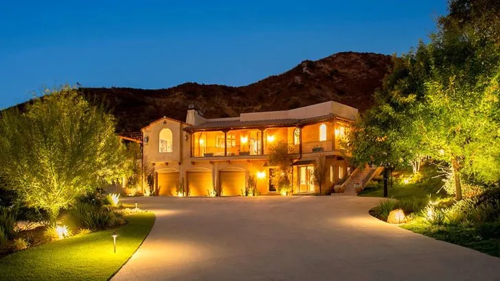 Night time view of the outside of Cole Hauser's California ranch